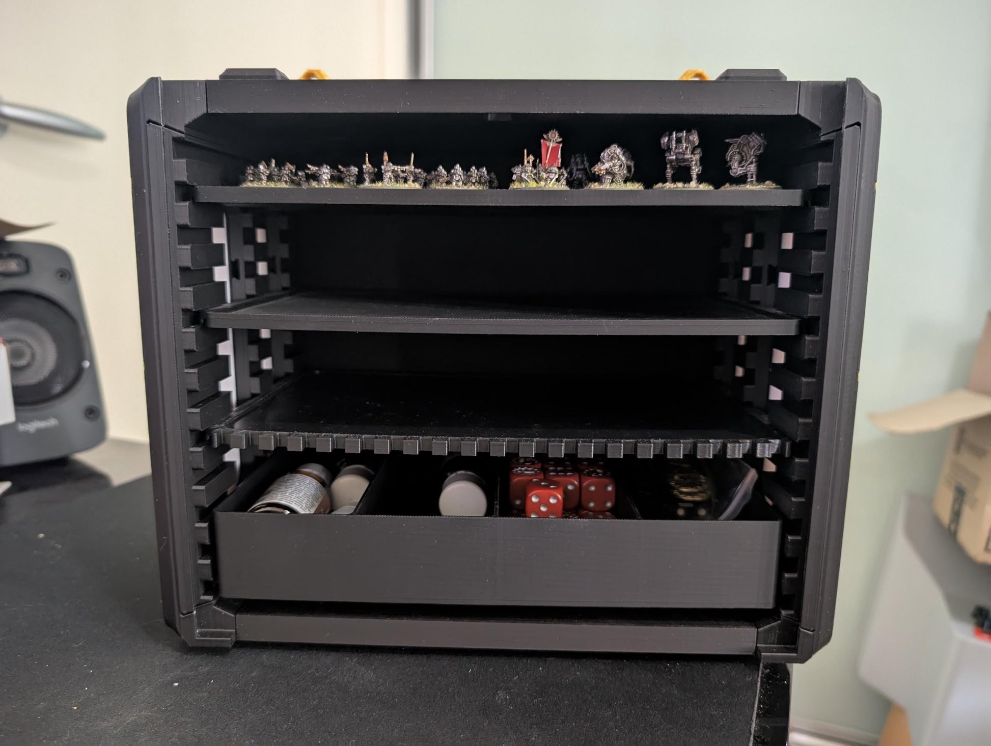 Layered Industries miniatures carrying case with multiple shelves and space for dice and accessories