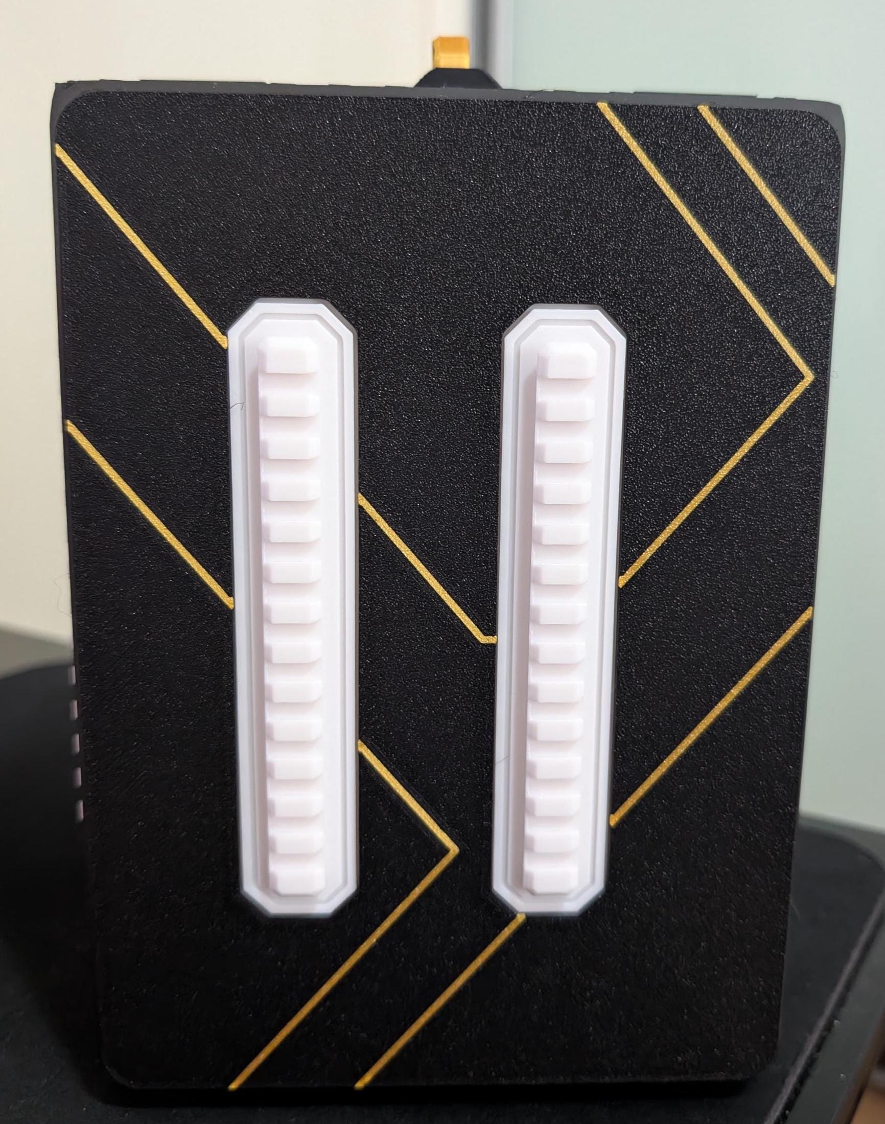 Layered Industries miniatures carrying case with a sleek black design and storage compartments