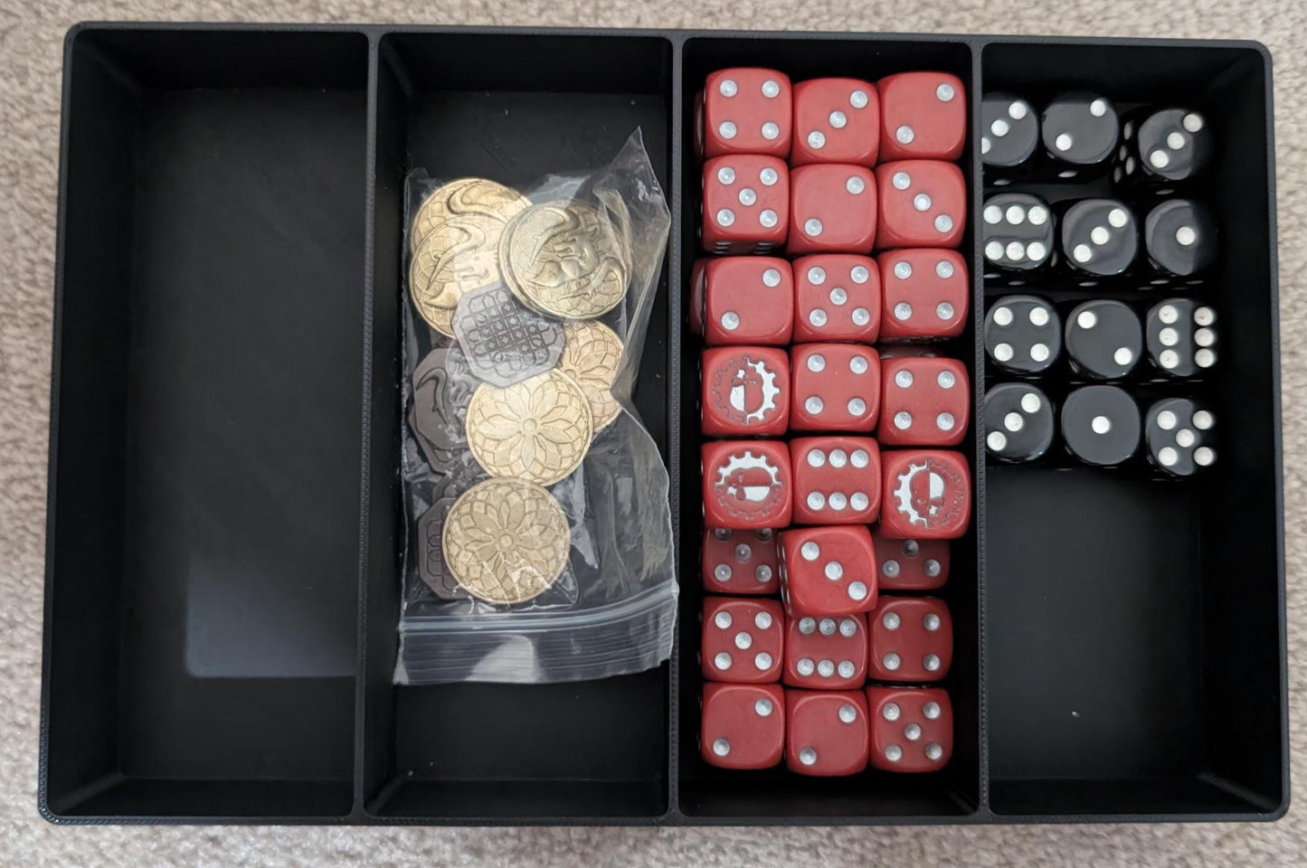 Layered Industries miniatures carrying case with compartments for dice and tokens