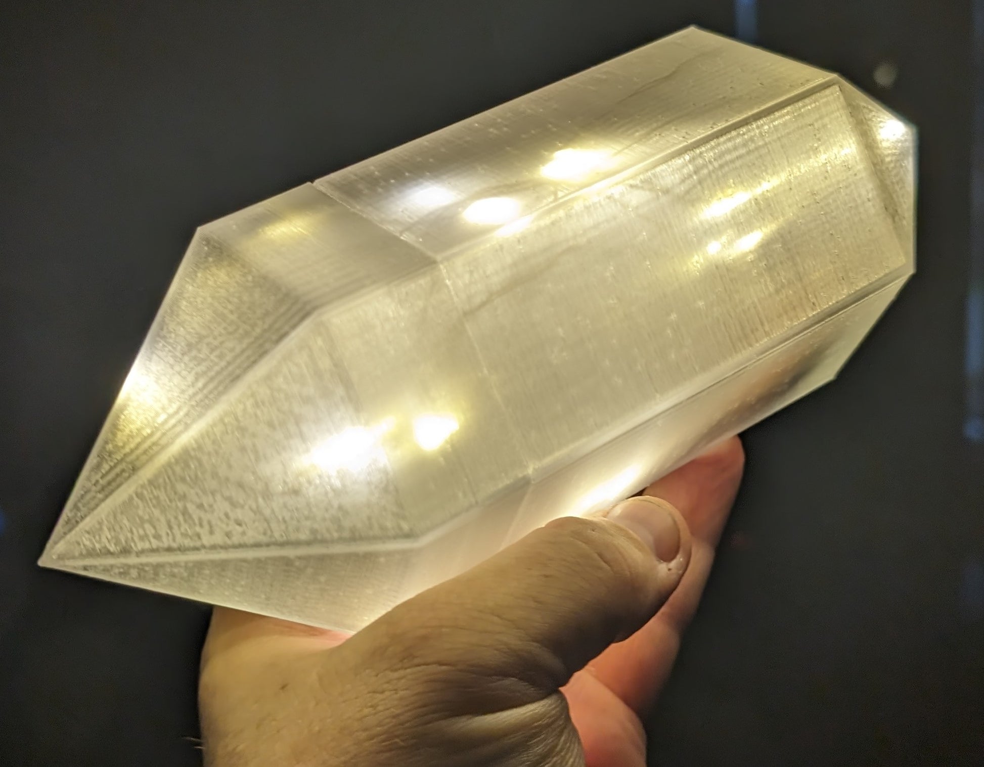 Layered Industries fantasy glowing crystal prop held in hand, perfect for wargame terrain.