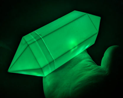 Layered Industries fantasy glowing crystal prop displayed on a hand with vibrant green illumination