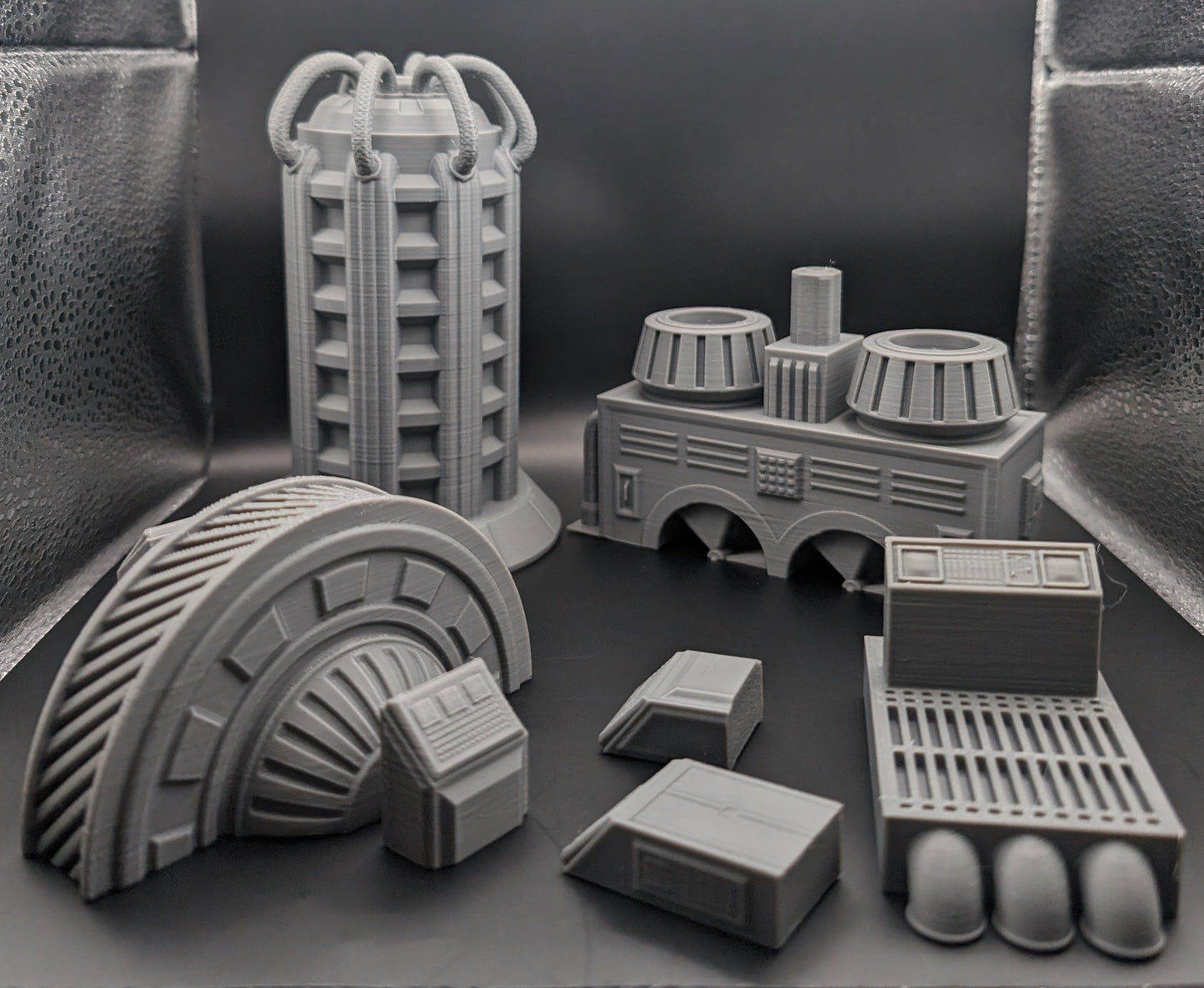 Layered Industries sci-fi terrain 3D prints including futuristic structures and detailed bases for tabletop games